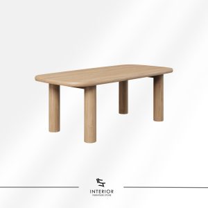 Rectangular solid wood dining table with rounded corners and cylindrical legs in natural finish