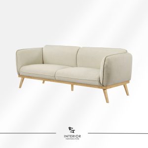 Minimalist upholstered sofa in light beige fabric with rounded armrests, smooth cushions, and natural wooden legs.