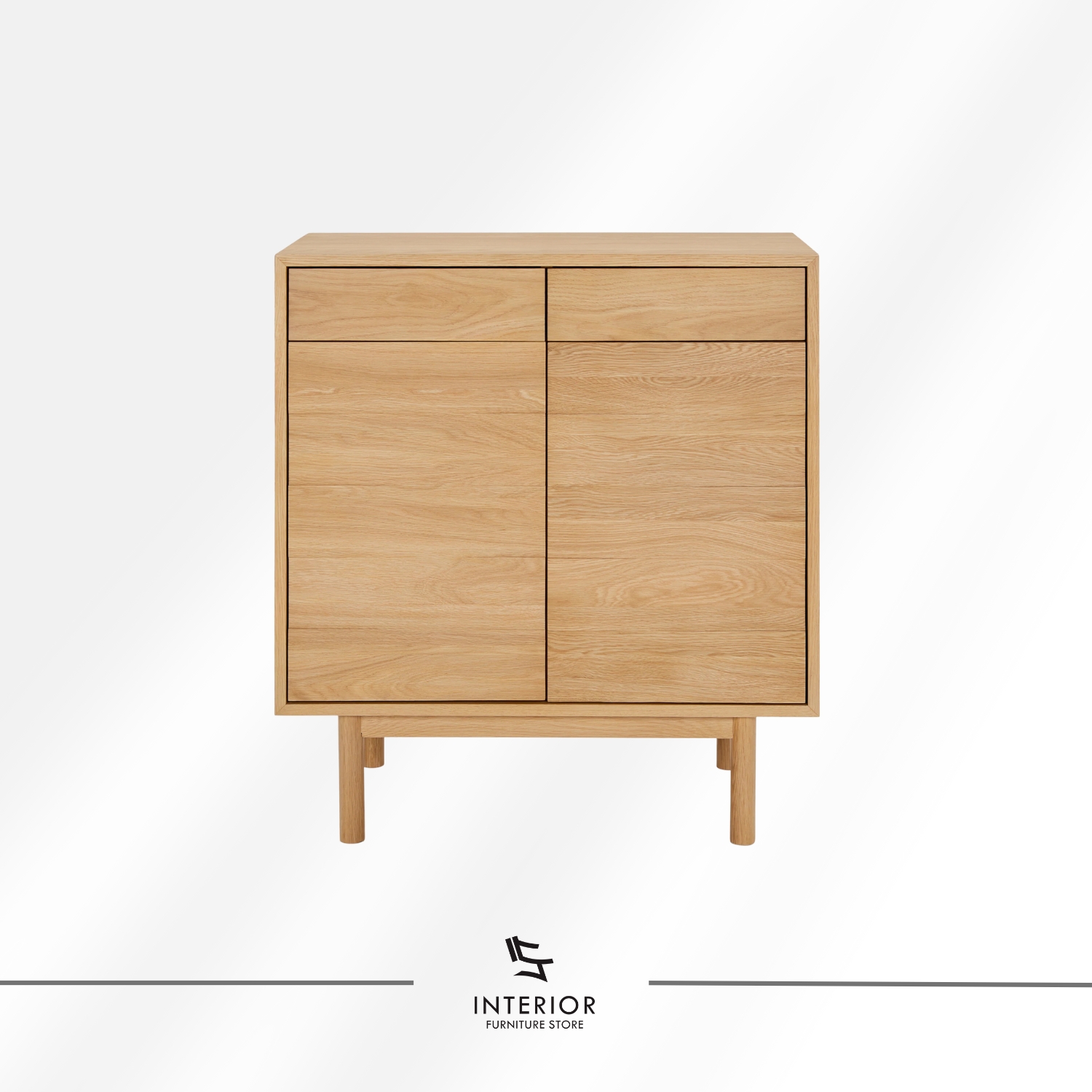 Light oak wooden cabinet with a clean rectangular form, featuring two upper drawers, double-door storage with interior shelving, and slender rounded legs.