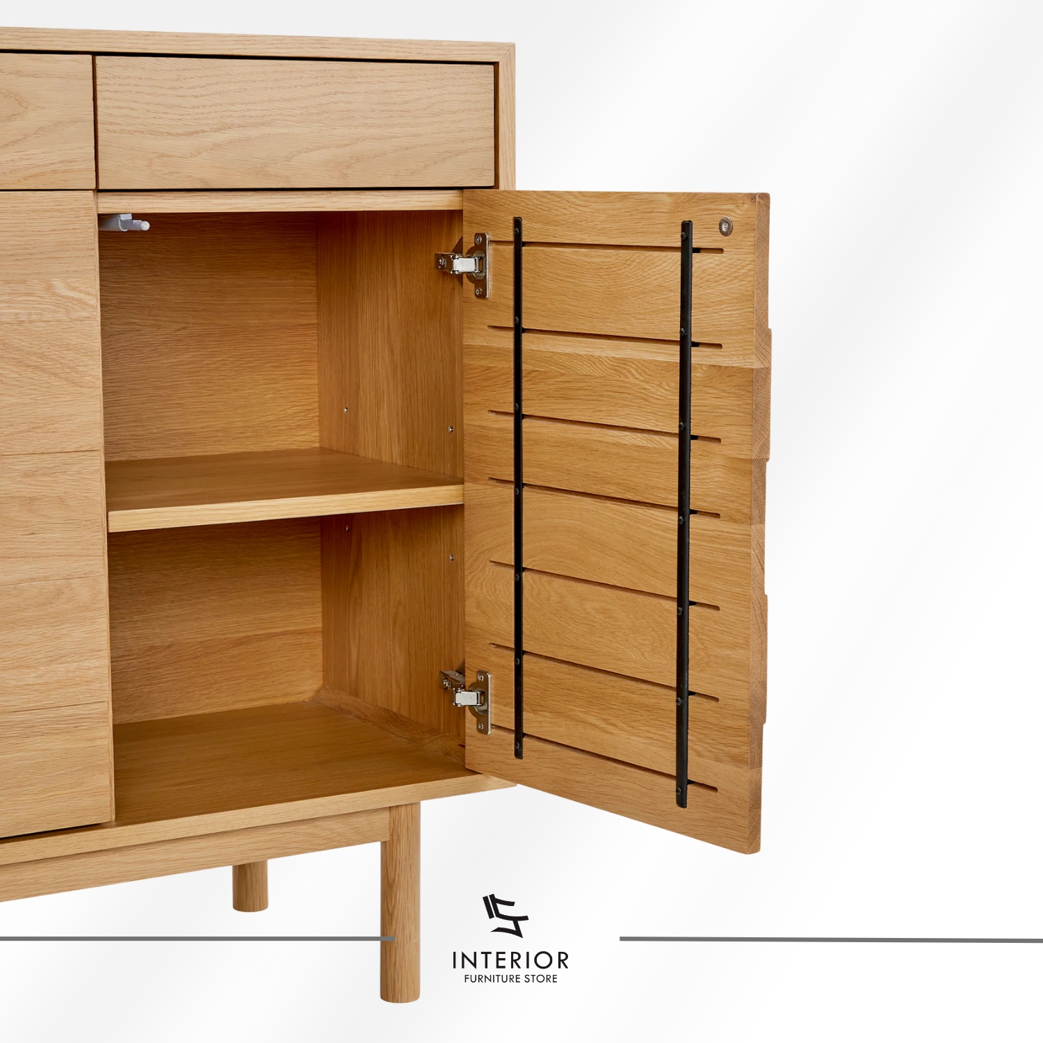Light oak wooden cabinet with a clean rectangular form, featuring two upper drawers, double-door storage with interior shelving, and slender rounded legs.