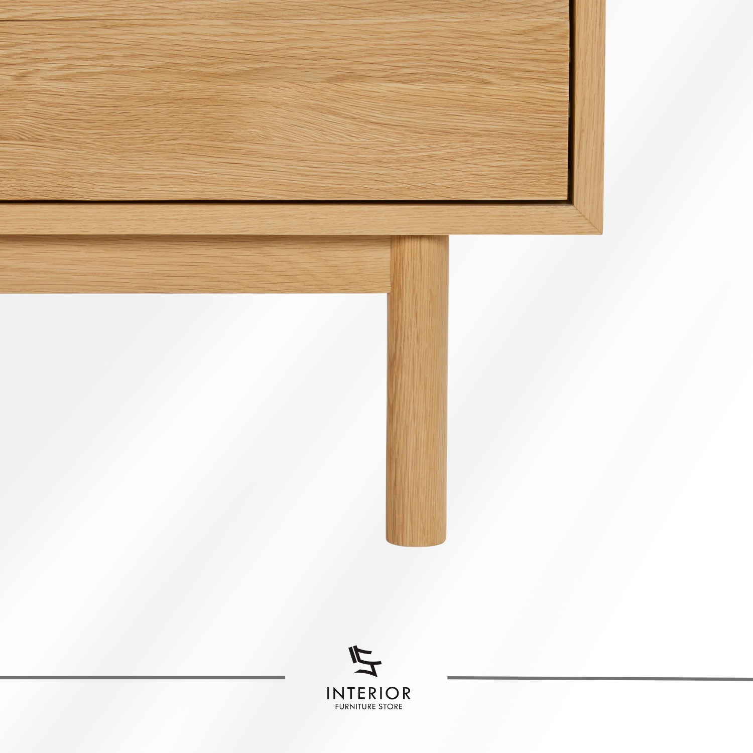 Light oak wooden cabinet with a clean rectangular form, featuring two upper drawers, double-door storage with interior shelving, and slender rounded legs.