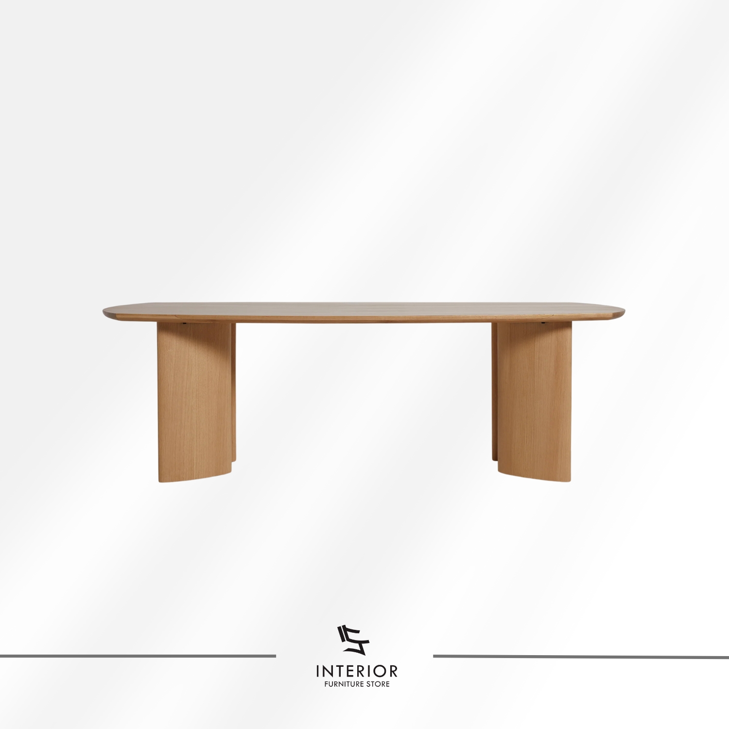 Modern solid wood dining table with elongated tabletop and sculptural wooden legs in natural finish