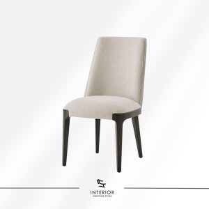 Upholstered dining chair with a curved backrest, beige fabric finish, and dark wooden legs.