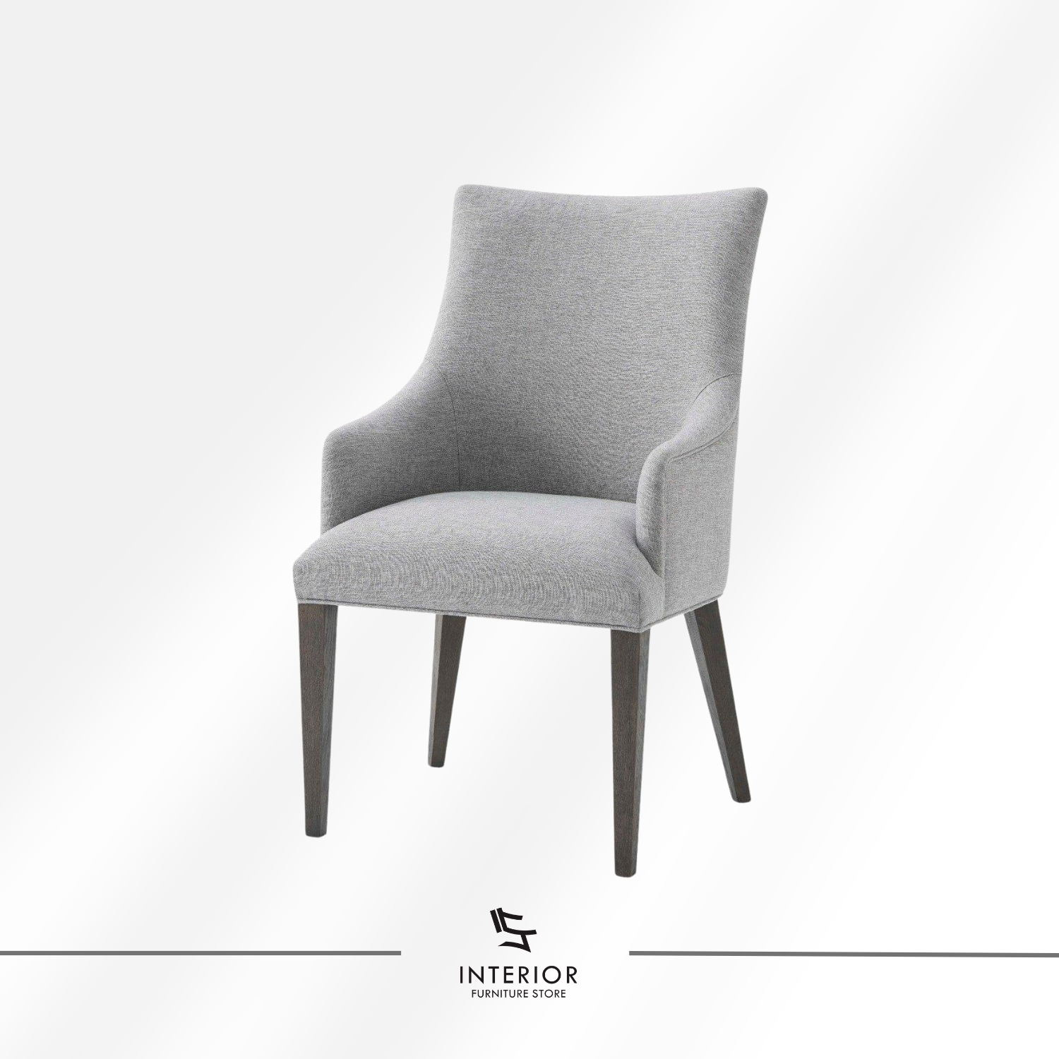 Upholstered dining chair with a light grey fabric finish, curved armrests, and dark wooden legs.