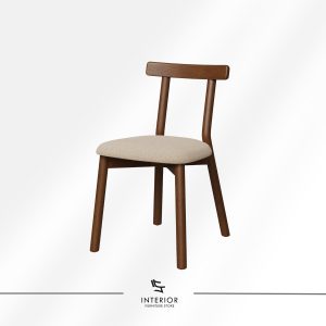 Solid wood dining chair with a warm walnut finish, featuring a gently curved backrest and a beige upholstered seat. The rounded legs and soft contours create a balanced and inviting silhouette.