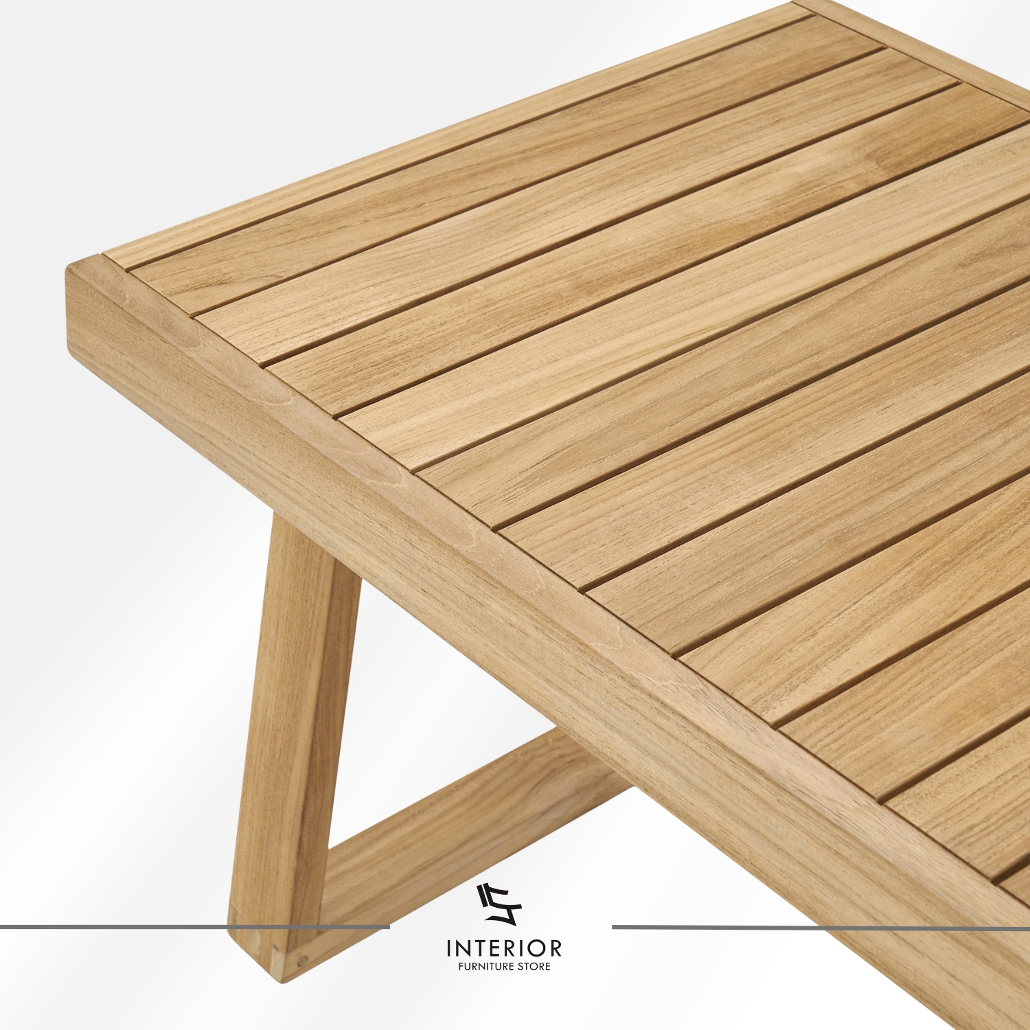 Rectangular wooden coffee table with a slatted top and angled frame legs in a natural finish.