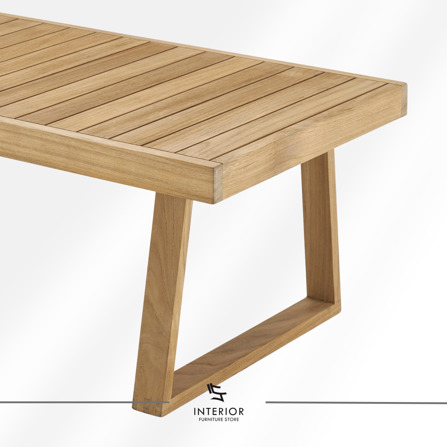 Rectangular wooden coffee table with a slatted top and angled frame legs in a natural finish.