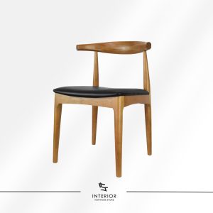Solid wood dining chair with a sculpted backrest, curved frame, and black cushioned seat.