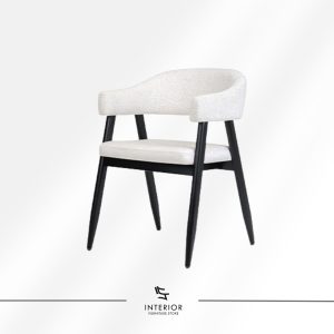 Upholstered dining chair with a curved wraparound backrest, cushioned seat, and tapered black wooden legs.