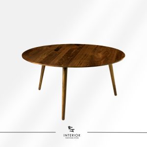 Round wooden coffee table with a rich natural grain top and tapered legs in a warm walnut finish.