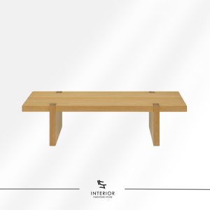 Rectangular solid wood coffee table with a thick tabletop, visible wood grain, and wide panel legs.