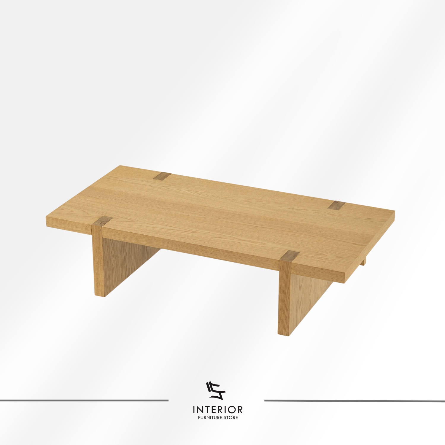 Rectangular solid wood coffee table with a thick tabletop, visible wood grain, and wide panel legs.