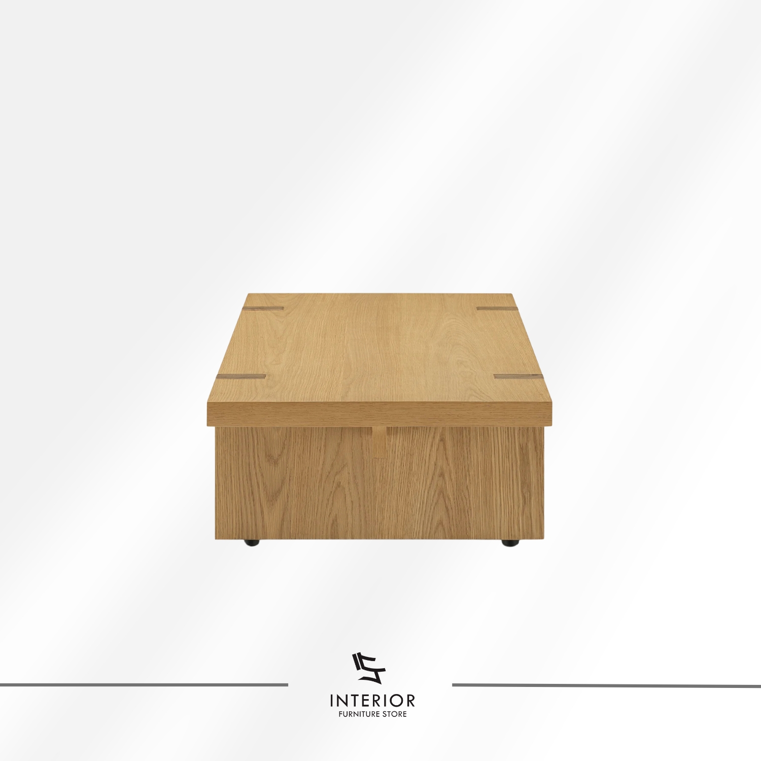 Rectangular solid wood coffee table with a thick tabletop, visible wood grain, and wide panel legs.