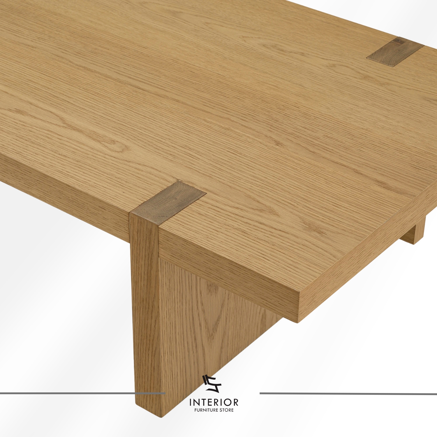 Rectangular solid wood coffee table with a thick tabletop, visible wood grain, and wide panel legs.