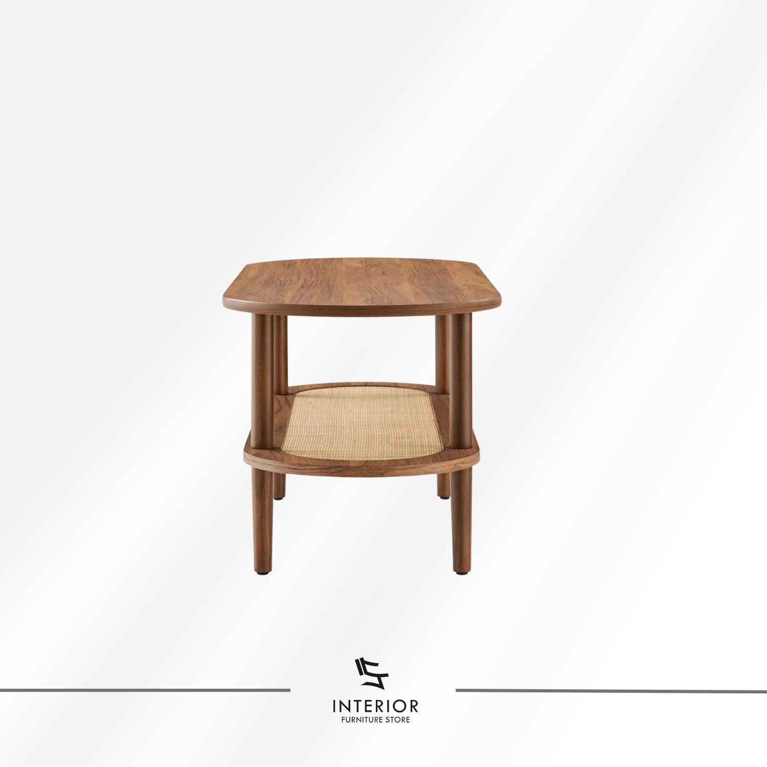 Oval wooden coffee table with a rounded top, cylindrical legs, and a lower shelf featuring woven rattan detail.
