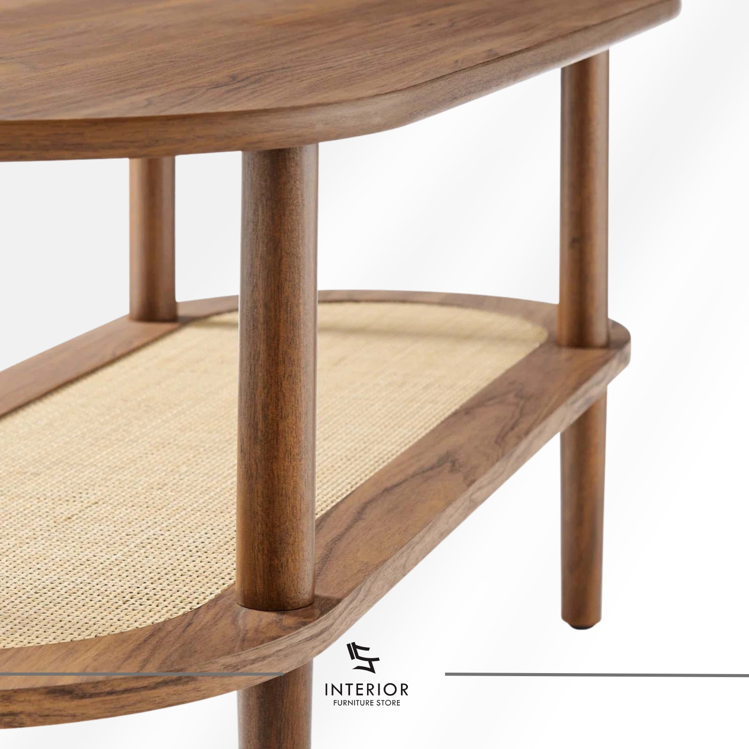 Oval wooden coffee table with a rounded top, cylindrical legs, and a lower shelf featuring woven rattan detail.