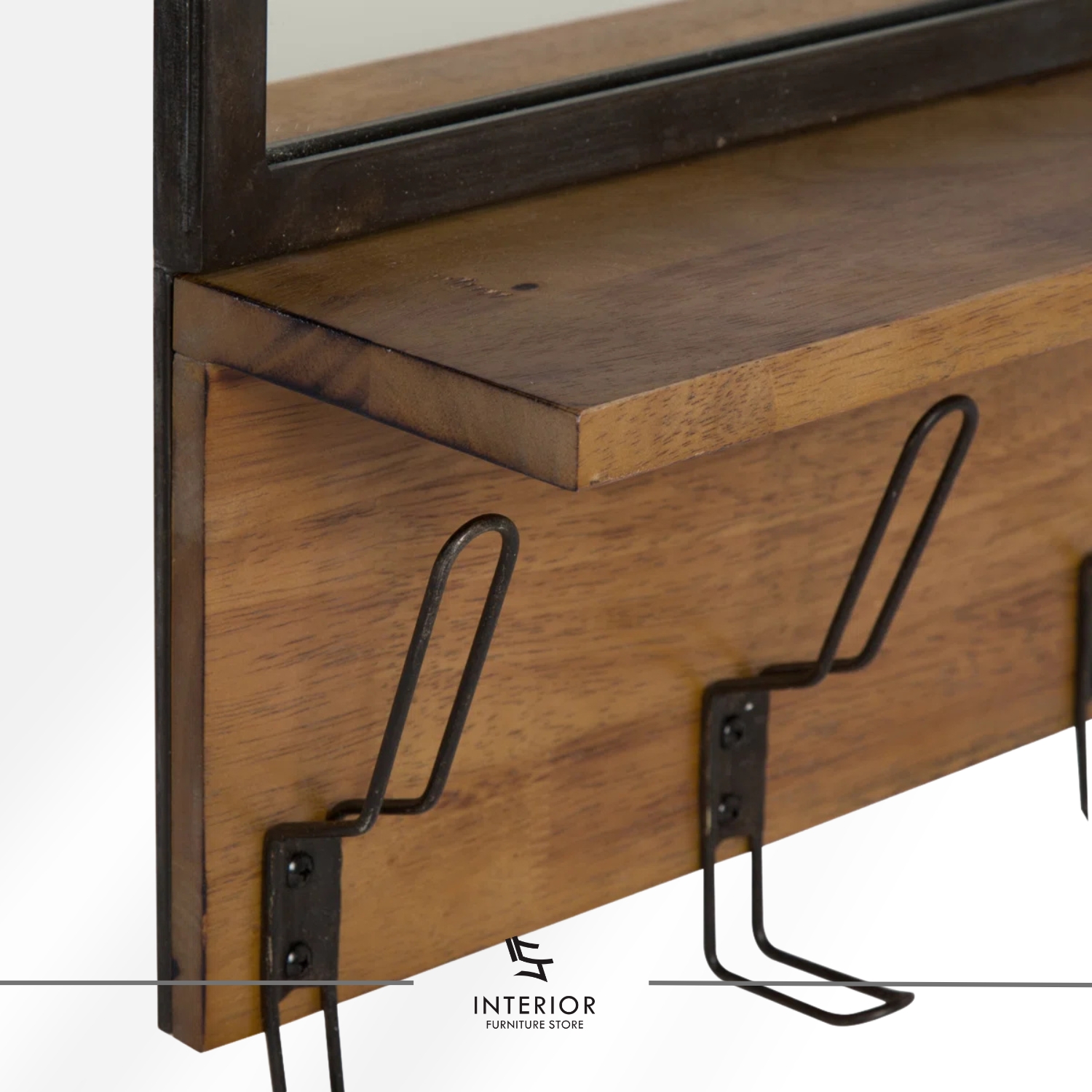 Wall-mounted entryway shelf with a rectangular mirror, warm wooden ledge, and multiple black metal hooks for hanging items.