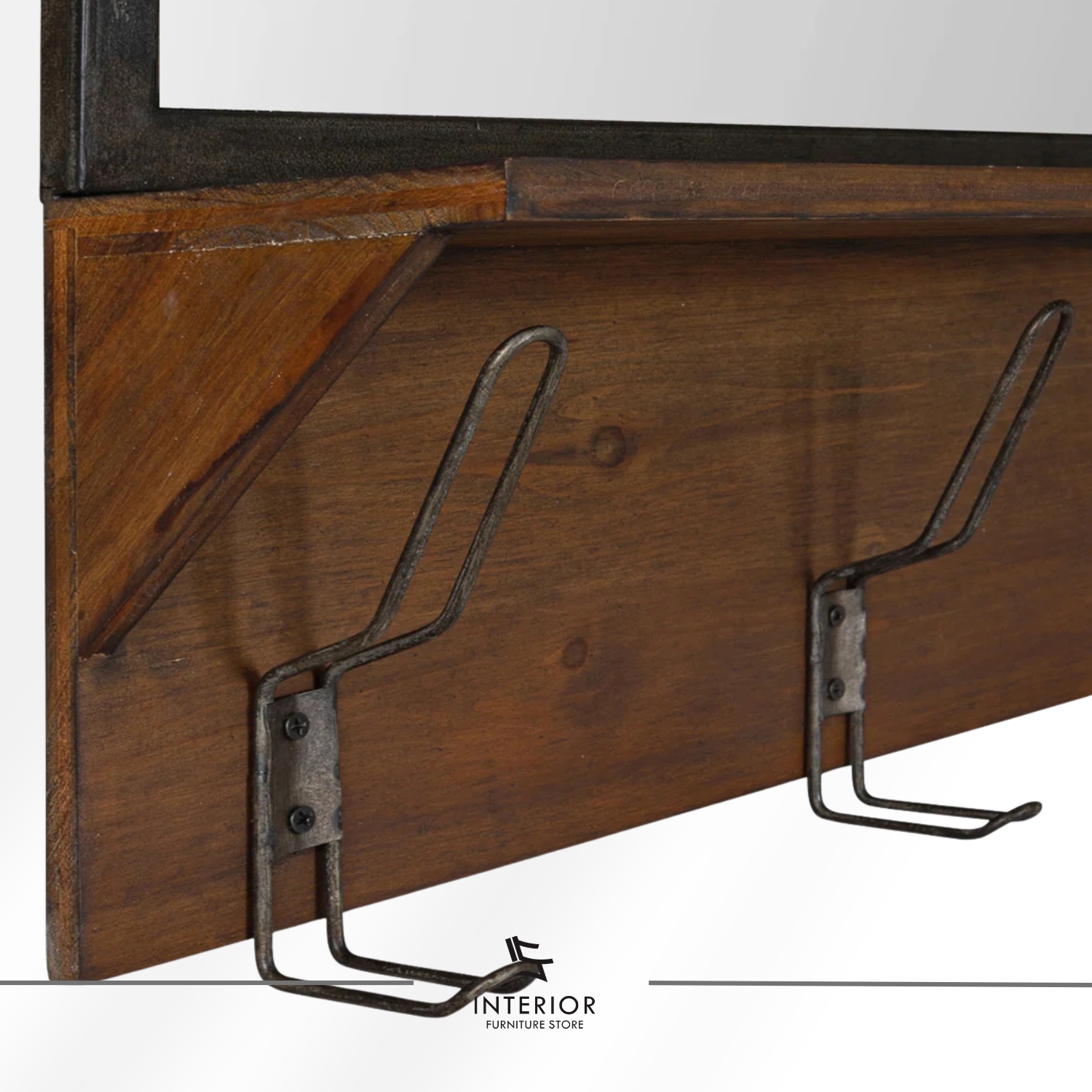 Wall-mounted entryway shelf with a rectangular mirror, warm wooden ledge, and multiple black metal hooks for hanging items.