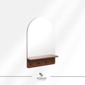 Wall mounted mirror with an arched top and a slim metal frame, paired with a wooden shelf and four hooks below. The warm wood tones and clean lines create a functional yet decorative entryway piece.