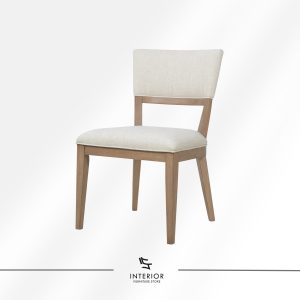 Upholstered dining chair with a gently angled backrest, cushioned seat, and light wood frame with tapered legs.
