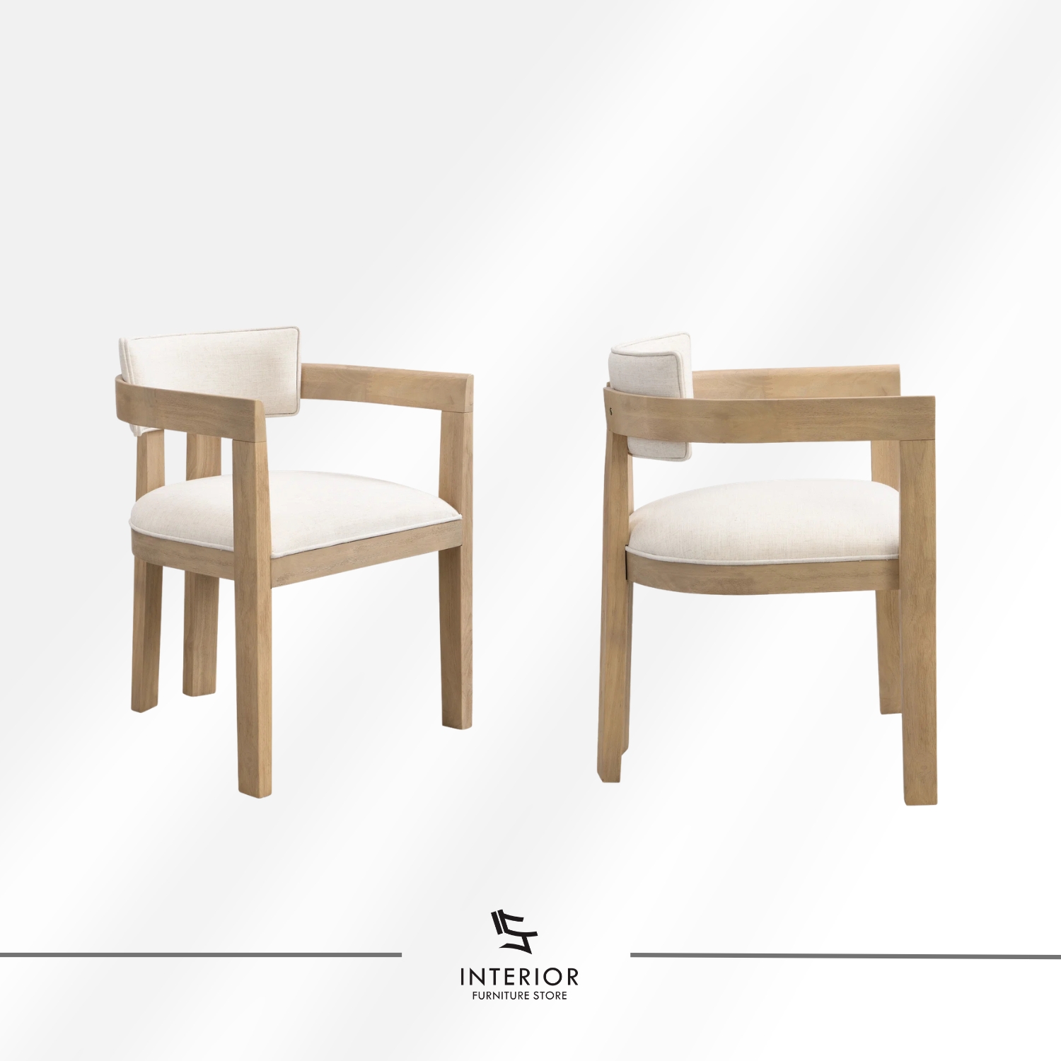 Light wood dining table set featuring six upholstered armchairs with curved backrests, soft neutral cushions, and a spacious rectangular tabletop designed for comfortable shared meals.