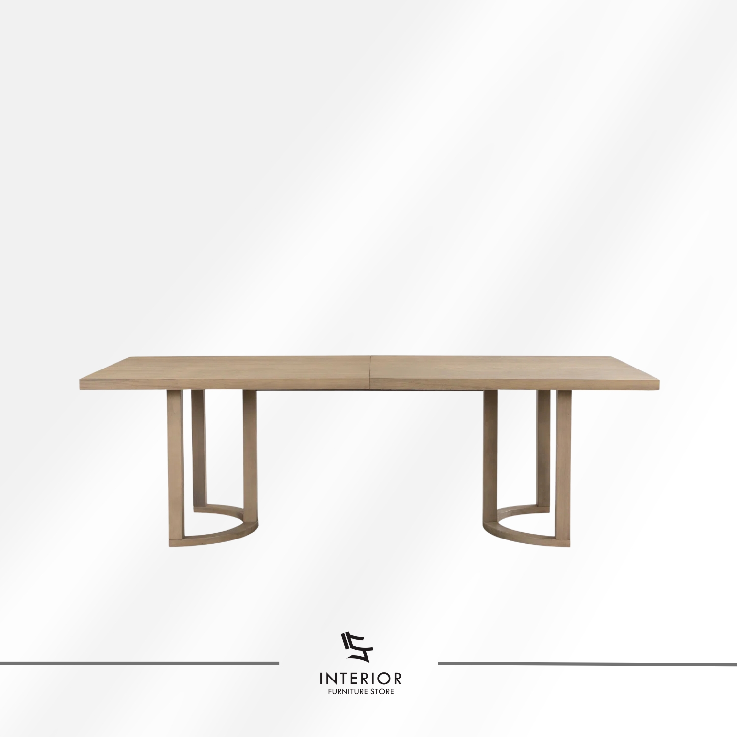 Light wood dining table set featuring six upholstered armchairs with curved backrests, soft neutral cushions, and a spacious rectangular tabletop designed for comfortable shared meals.