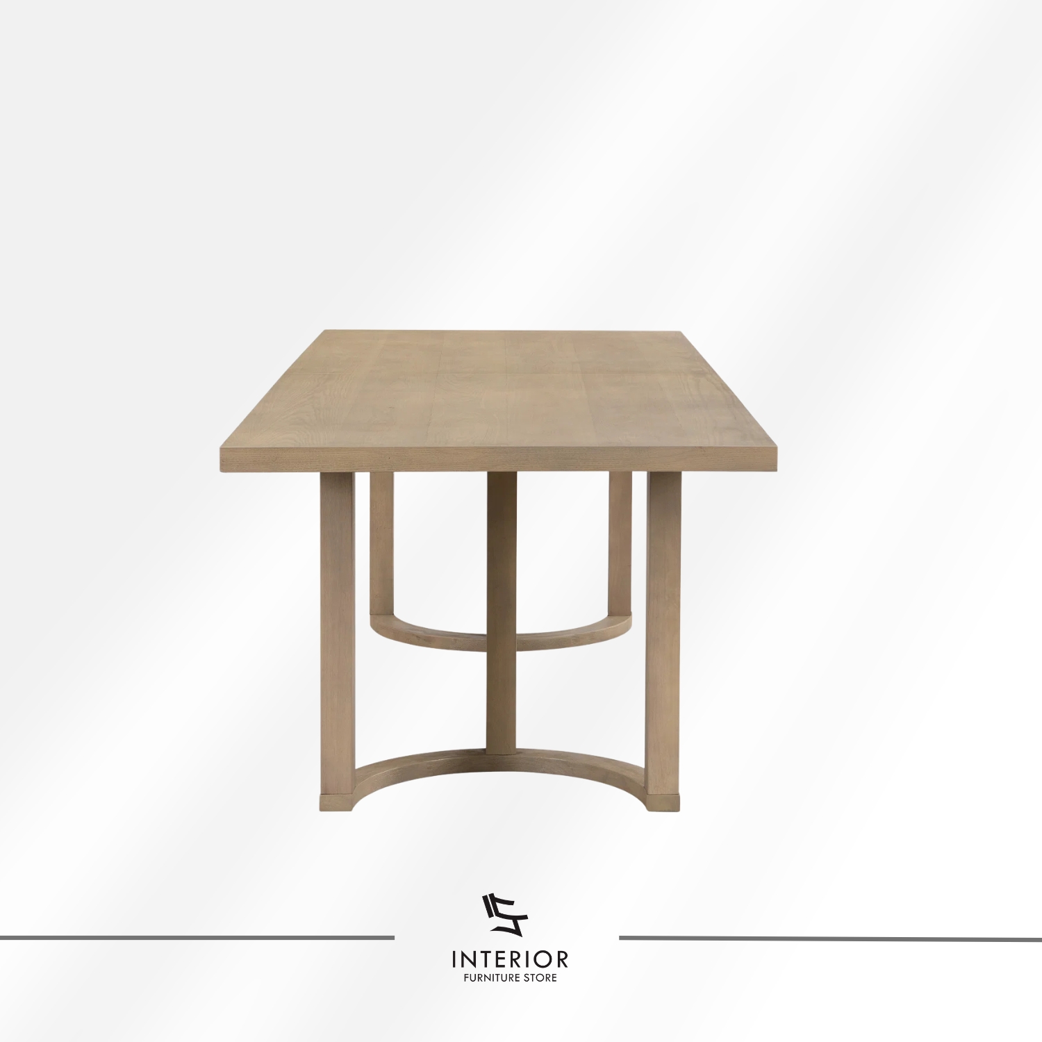 Light wood dining table set featuring six upholstered armchairs with curved backrests, soft neutral cushions, and a spacious rectangular tabletop designed for comfortable shared meals.