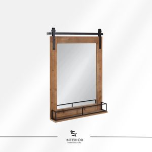 Wall mounted mirror with a natural wood frame, sliding barn-style metal rail, and a slim lower shelf with black metal guard.