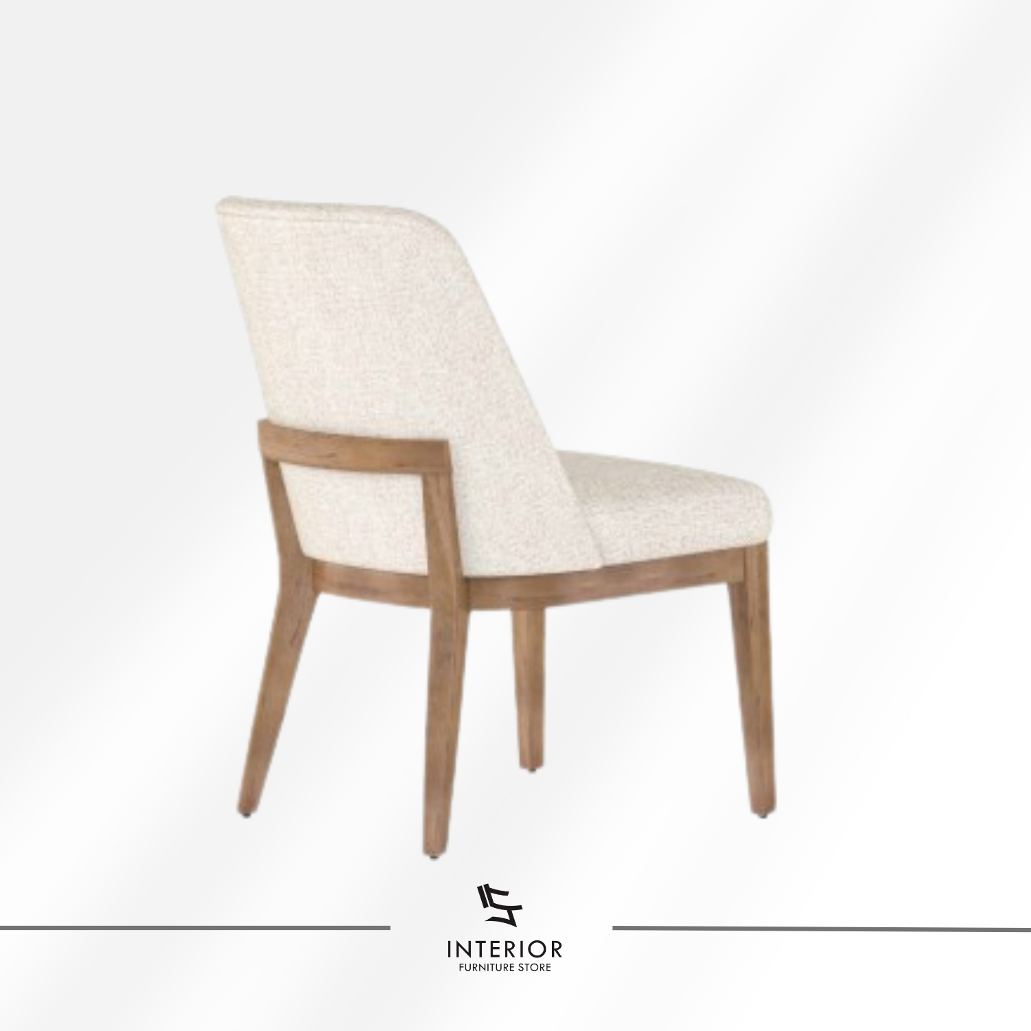 Upholstered dining chair with a softly curved backrest, padded seat, and natural wood legs.