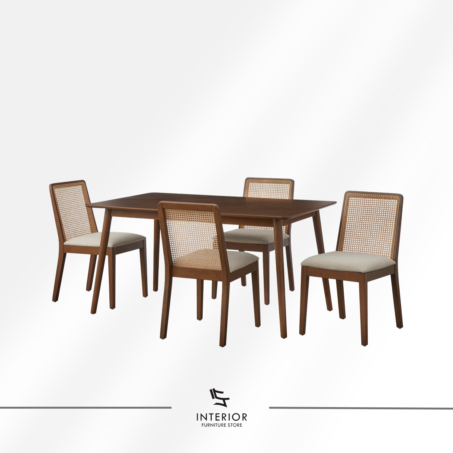 Solid wood dining table set with four chairs, featuring woven rattan backrests, soft upholstered seats, and a warm brown finish that enhances its clean, timeless appeal.