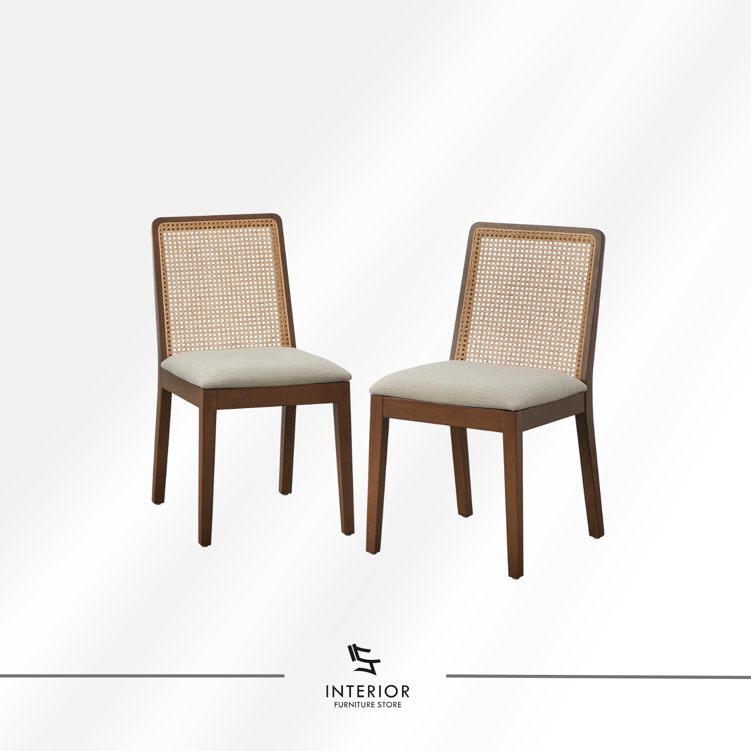 Solid wood dining table set with four chairs, featuring woven rattan backrests, soft upholstered seats, and a warm brown finish that enhances its clean, timeless appeal.