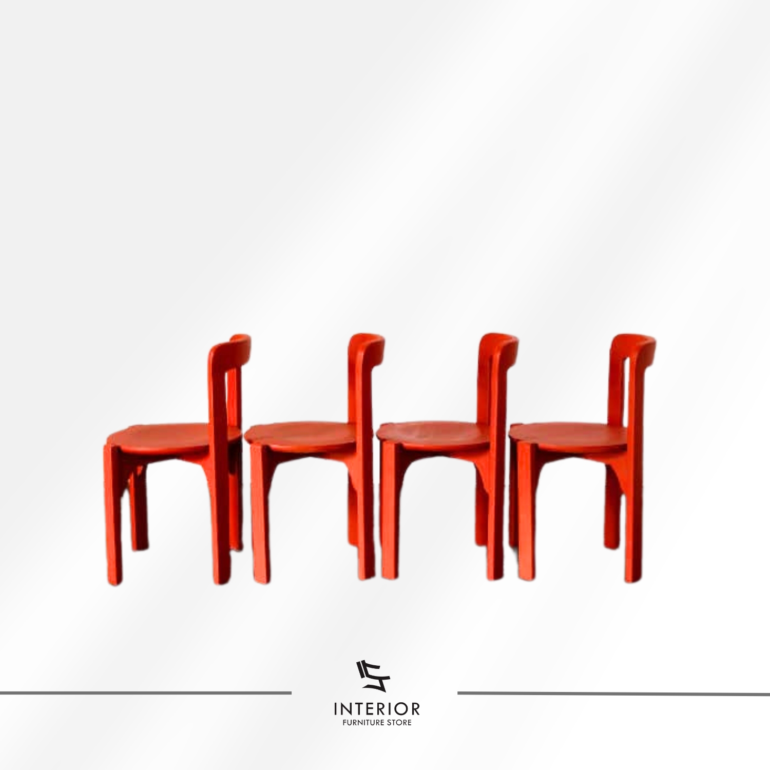 Red dining chair with a rounded seat and curved backrest.