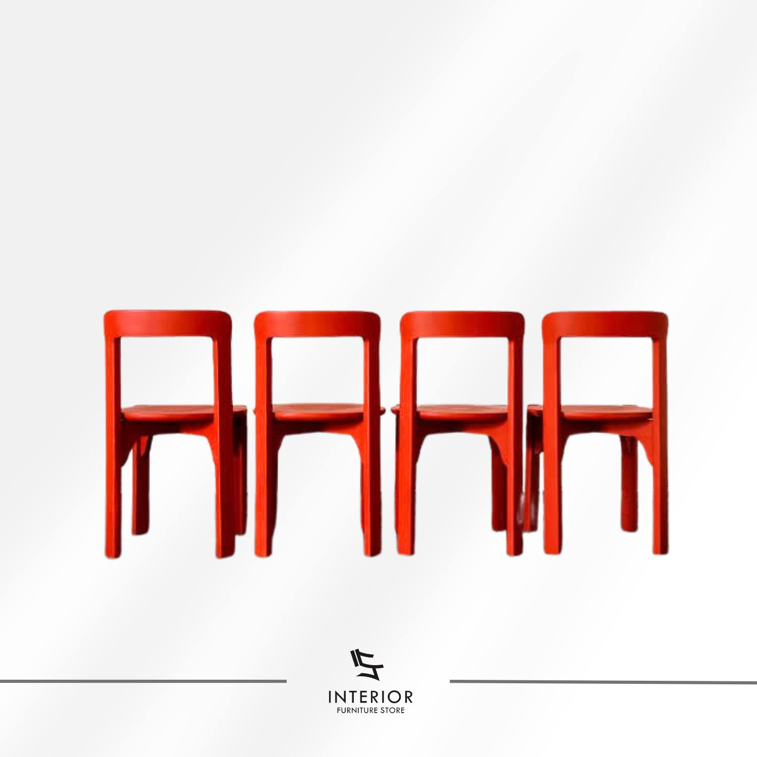 Red dining chair with a rounded seat and curved backrest.