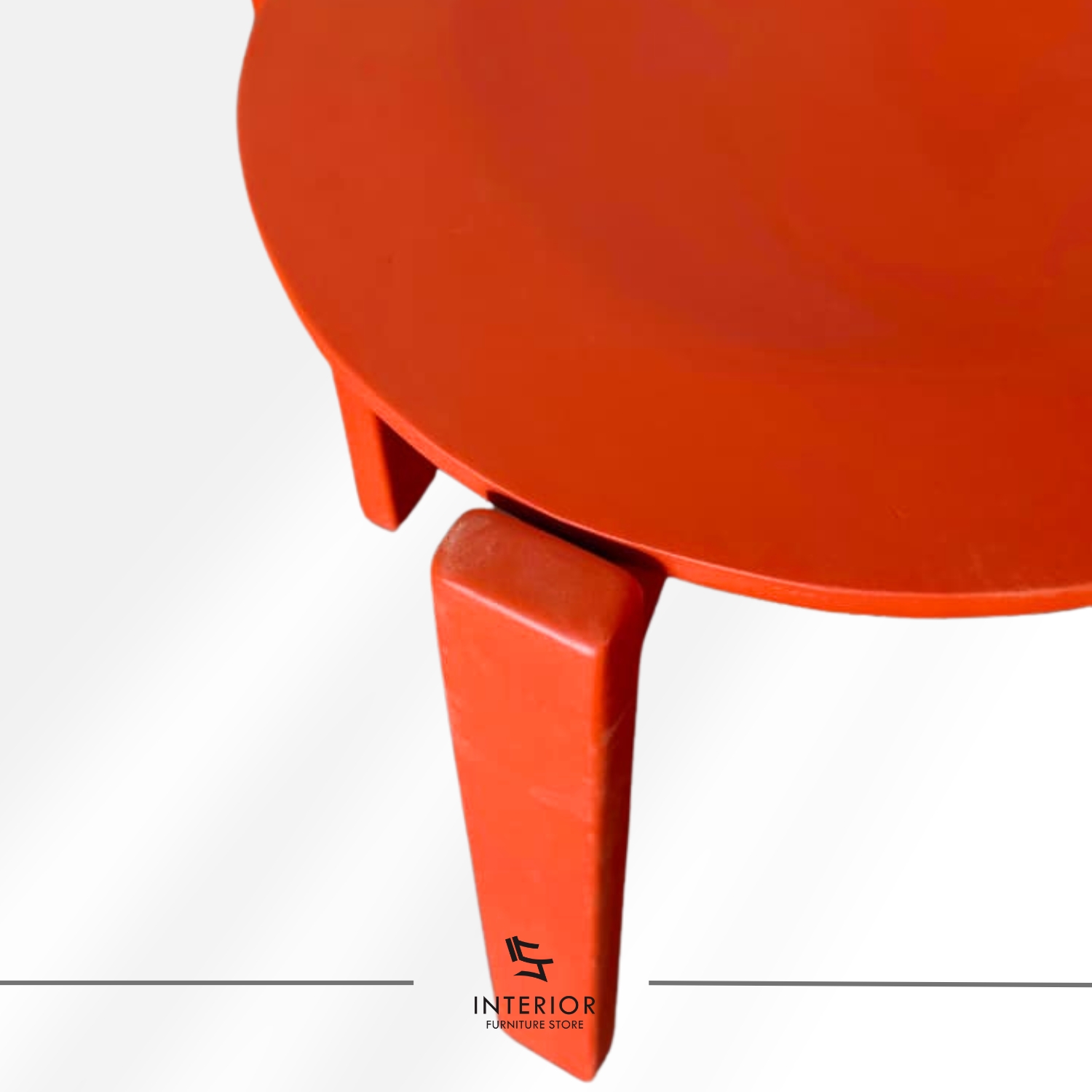 Red dining chair with a rounded seat and curved backrest.