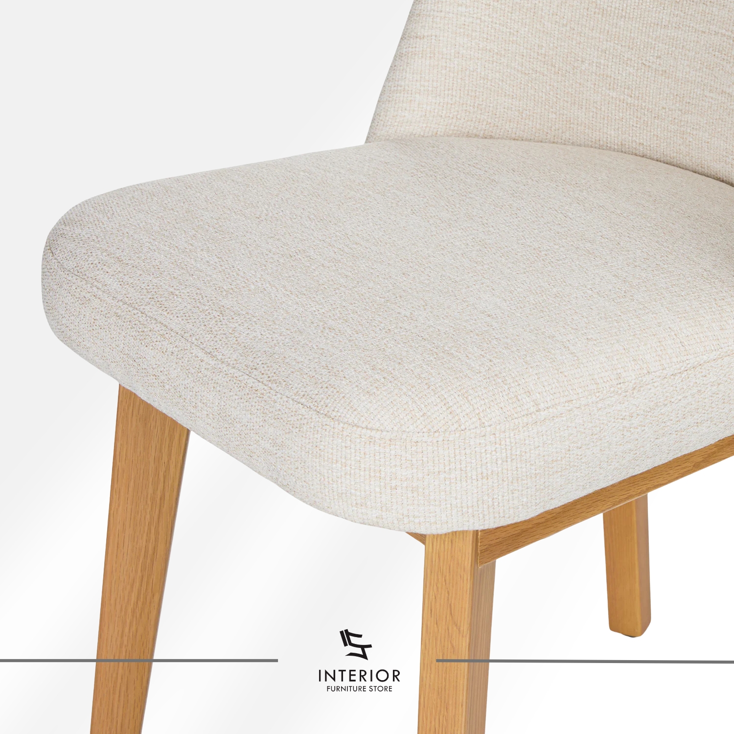 Upholstered dining chair with curved backrest and natural wooden legs.