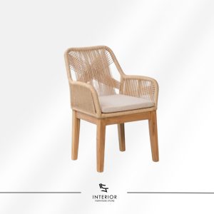 Dining chair with woven rope backrest, wooden legs, and a soft seat cushion.