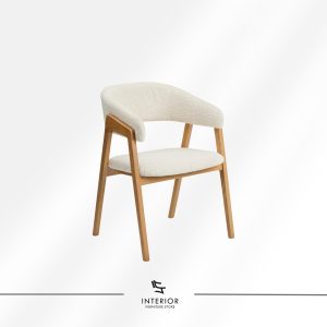 Upholstered dining chair with curved backrest and natural wooden legs.