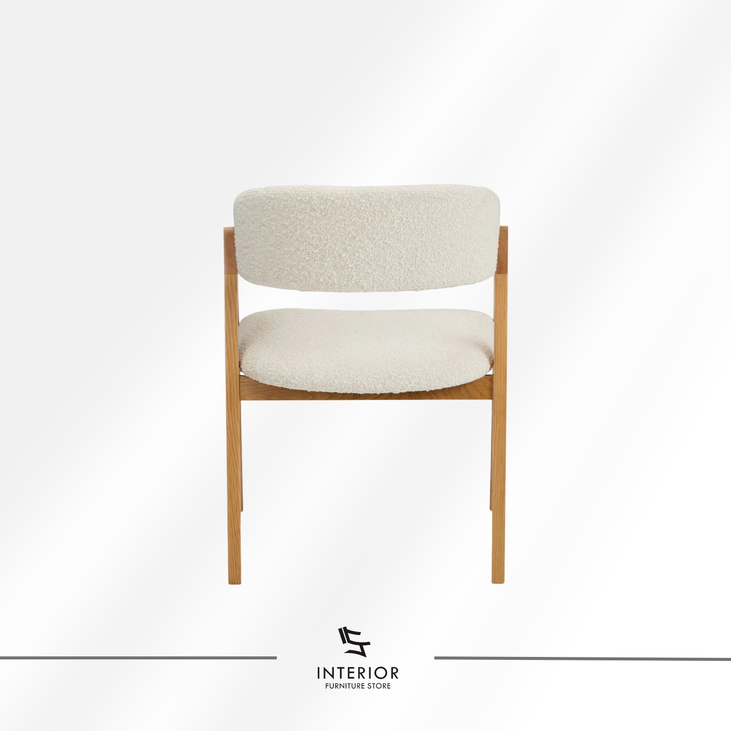 Upholstered dining chair with curved backrest and natural wooden legs.