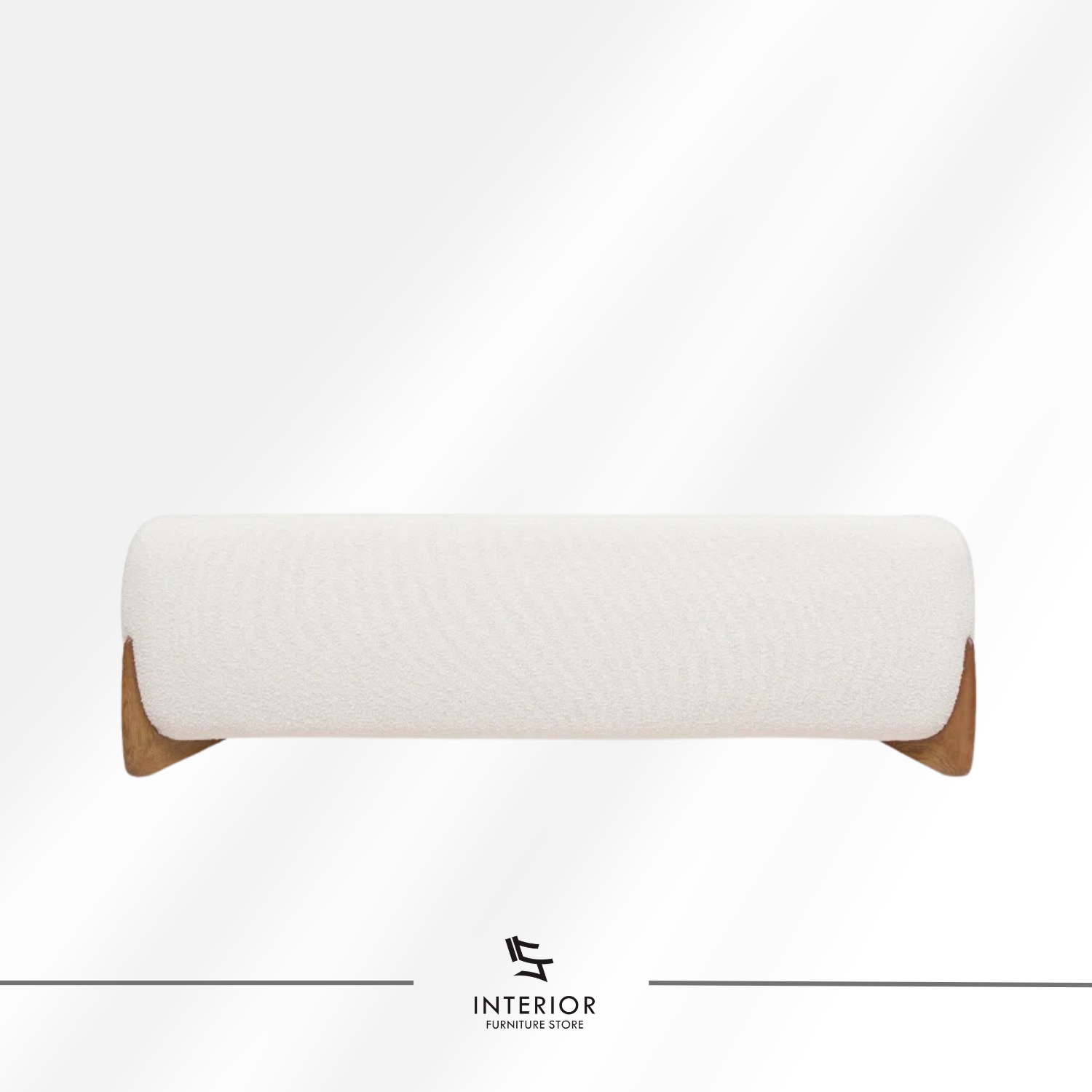 Curved modern sofa with textured cream upholstery and sculpted wooden side supports.
