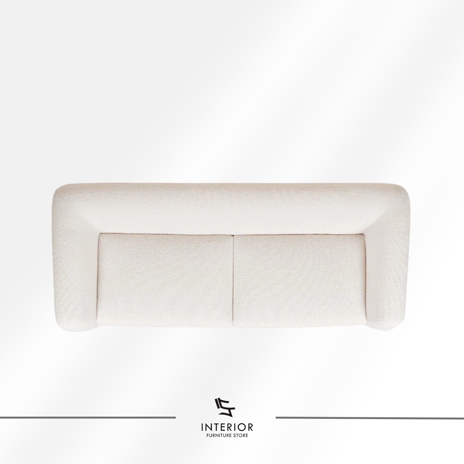 Curved modern sofa with textured cream upholstery and sculpted wooden side supports.