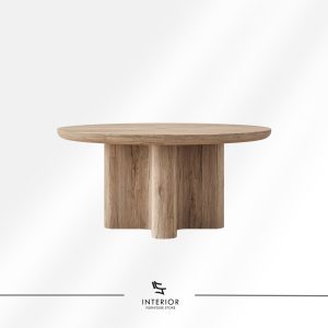 Round wooden dining table with a thick tabletop and curved panel pedestal base.