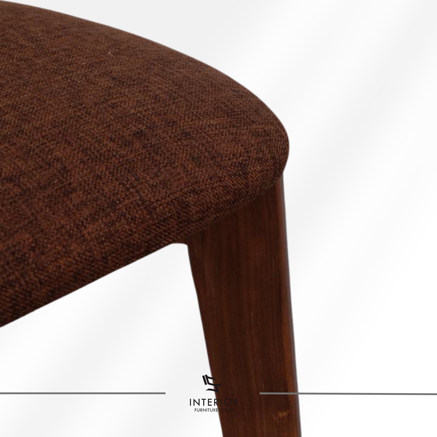 Wooden dining chair with curved backrest and upholstered seat.