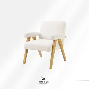 Upholstered armchair with soft fabric seat and natural wooden legs.