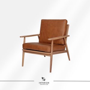 Solid wood armchair with angled frame and brown leather cushion, minimalist modern design