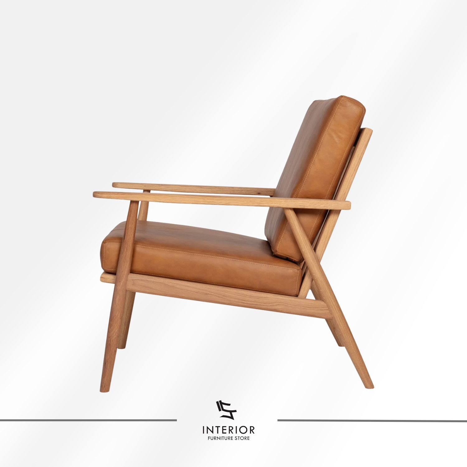 Solid wood armchair with angled frame and brown leather cushion, minimalist modern design
