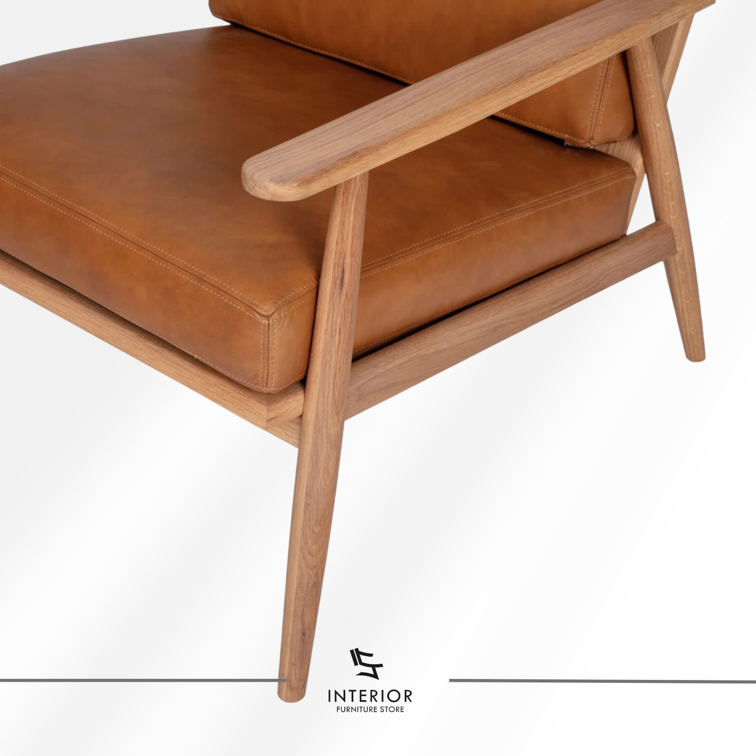 Solid wood armchair with angled frame and brown leather cushion, minimalist modern design