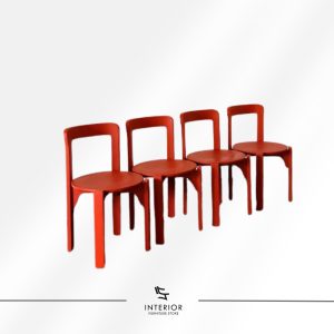 Red dining chair with a rounded seat and curved backrest.