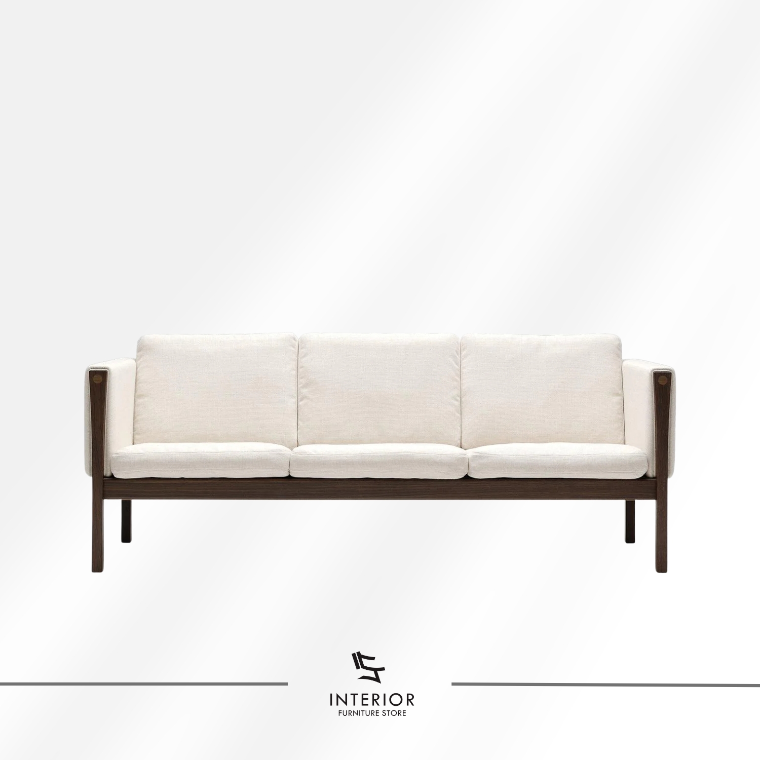 Modern wooden frame sofa with cream cushions, clean lines, and a minimalist silhouette.