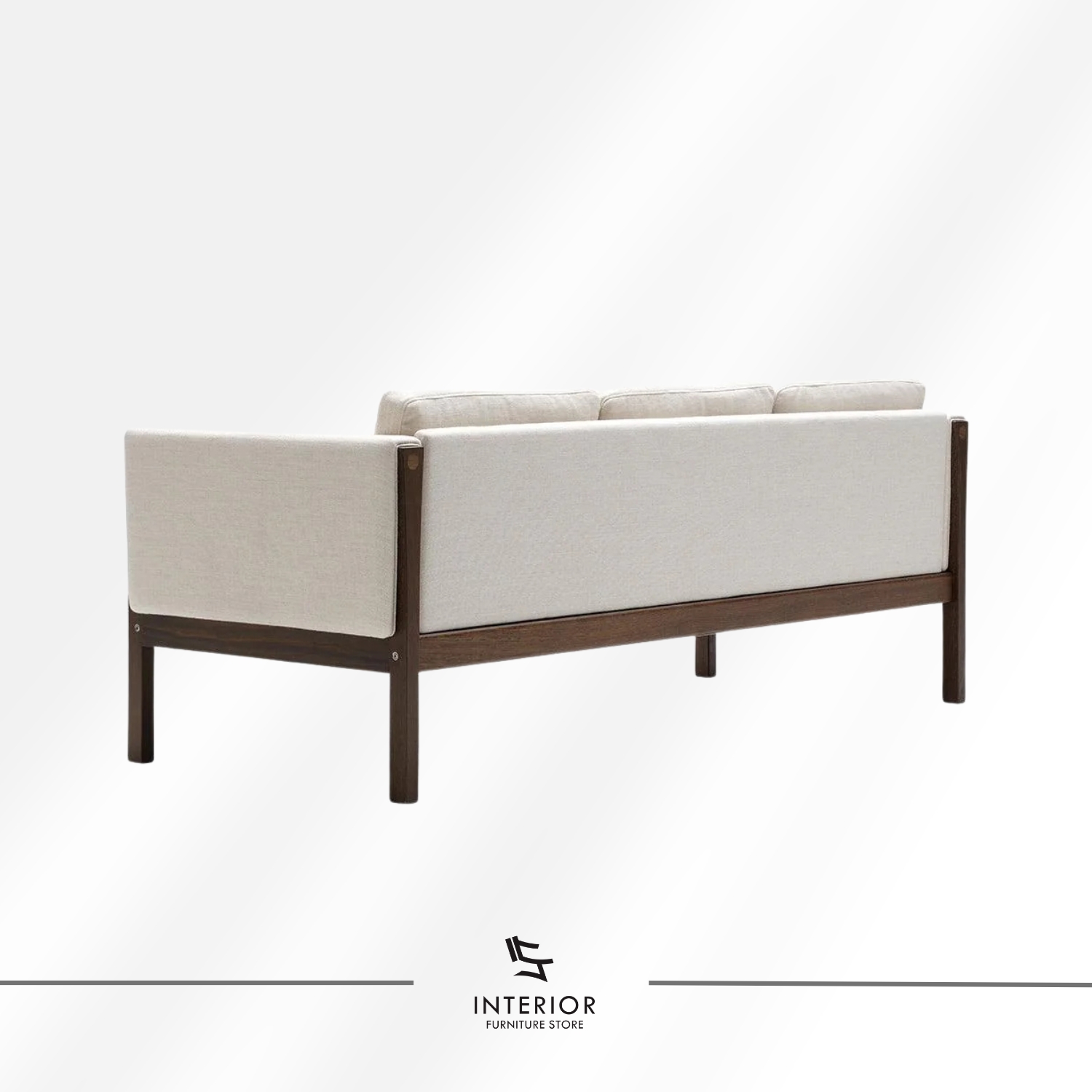 Modern wooden frame sofa with cream cushions, clean lines, and a minimalist silhouette.