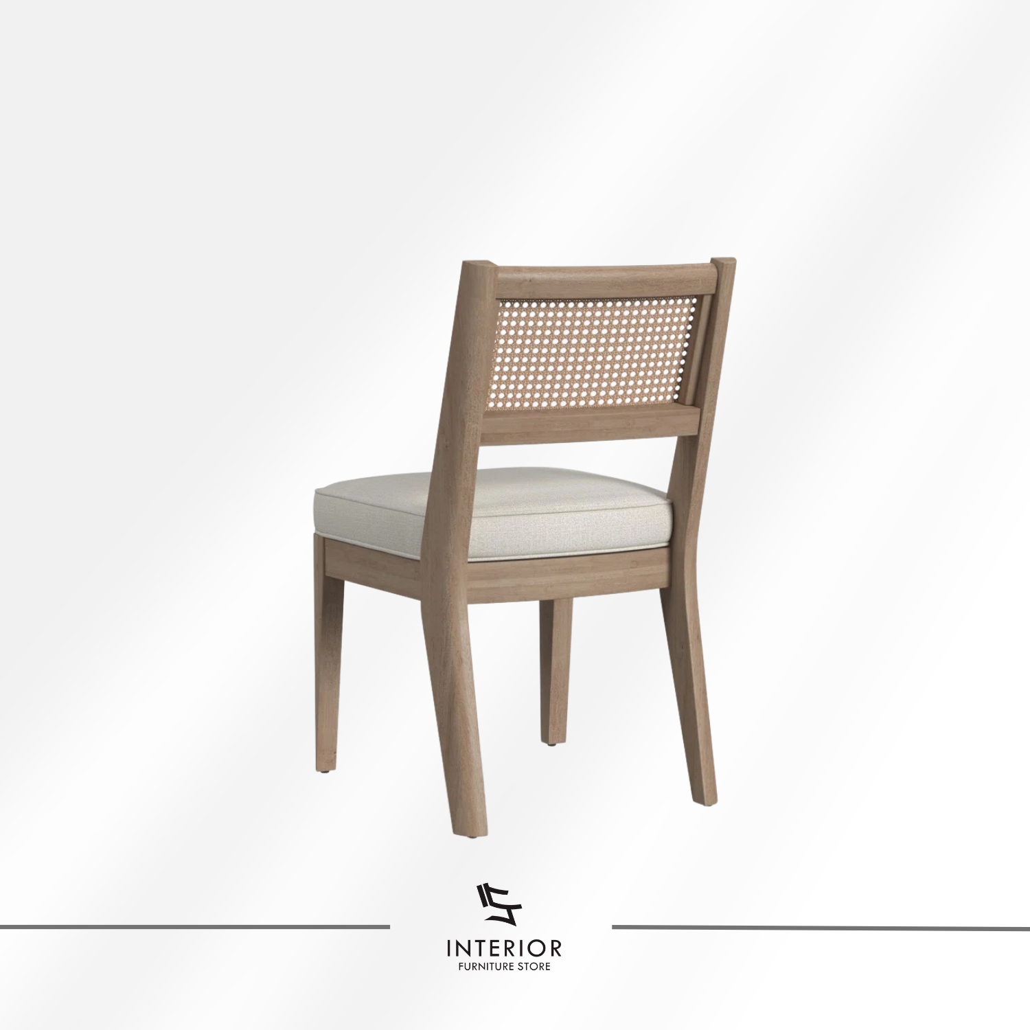 Wooden dining chair with a woven cane backrest and a cushioned upholstered seat.